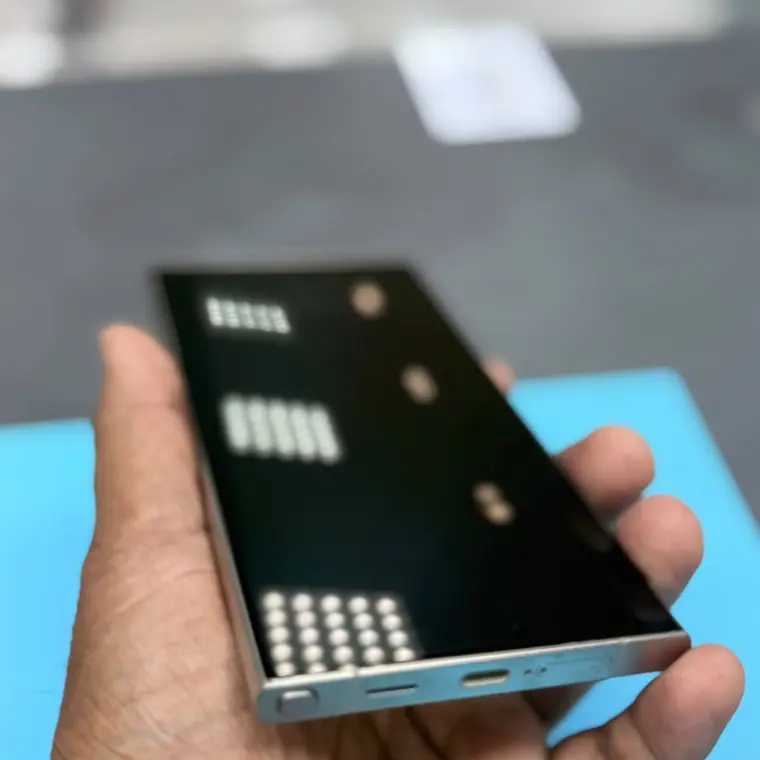 A phone being checked over at the Tech Tronex repair counter