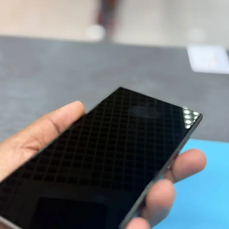 A graded Galaxy S25 Ultra being checked over at the Tech Tronex counter